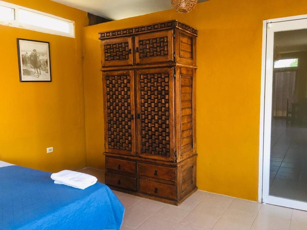Postel nebo postele na pokoji v ubytování Casa Hacienda San Gabriel