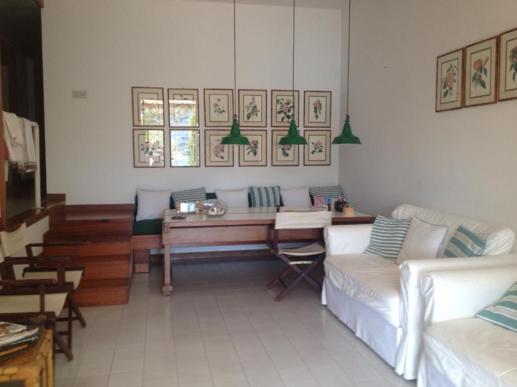 a living room with a table and a couch at Apartment Portovenere in Portovenere