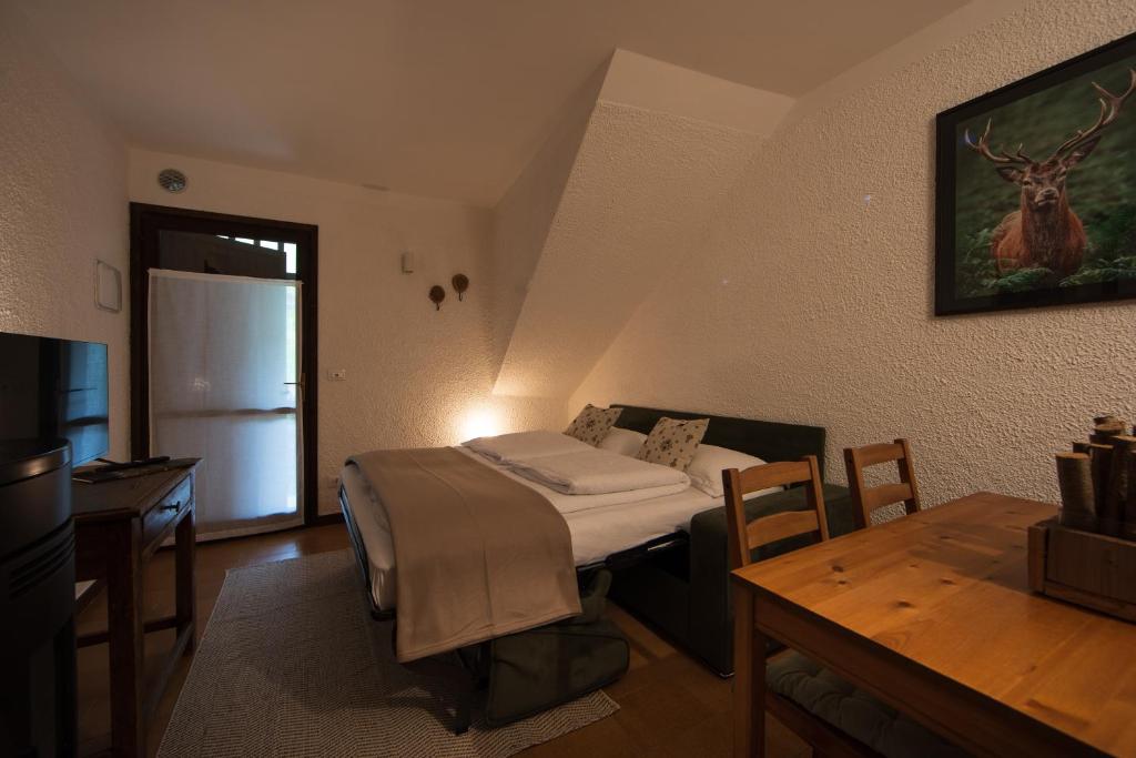 A bed or beds in a room at bb26 apartment mountain Lozio