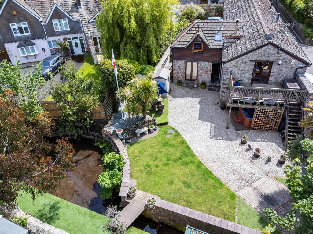 an aerial view of a house with a yard at Brook Barn, Idyllic Brixham Retreat with Hot Tub & Parking in Brixham