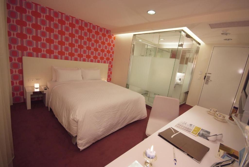 Postel nebo postele na pokoji v ubytování Hotel Purity