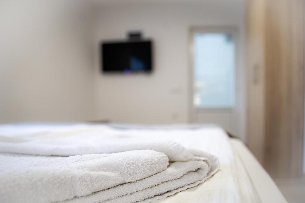 Postel nebo postele na pokoji v ubytování S&M Apartmani