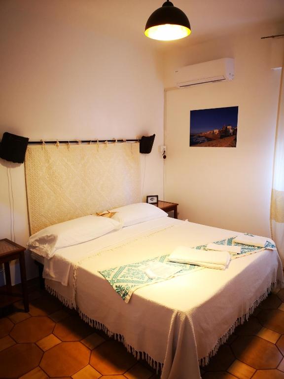 Postel nebo postele na pokoji v ubytování Antonhouse Alghero