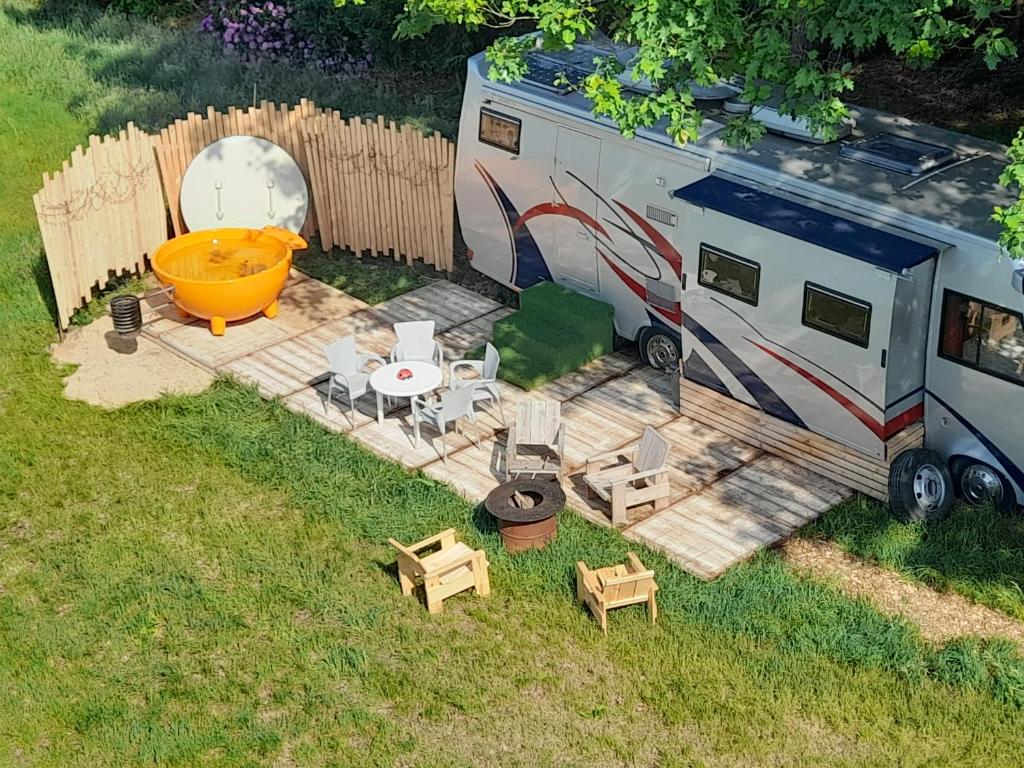 an aerial view of an rv and a table and chairs at Kromven On Wheels in Merksplas