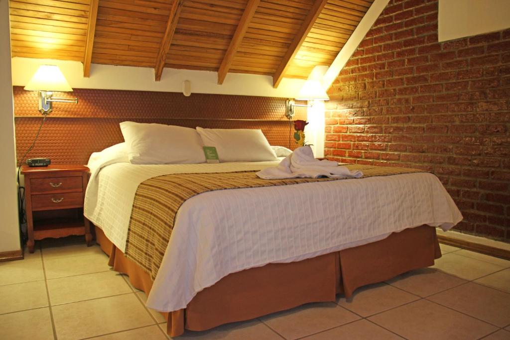 Postel nebo postele na pokoji v ubytování Hotel Balandra