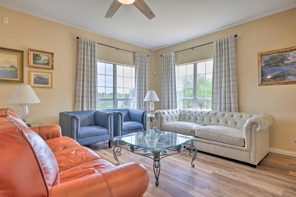 a living room with couches and a coffee table at Fox Ridge Farmhouse - Hill Country Getaway! in San Marcos