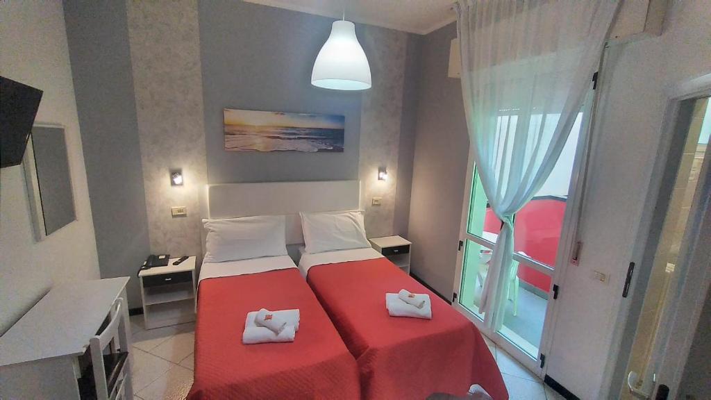 Letto o letti in una camera di Hotel Mizar