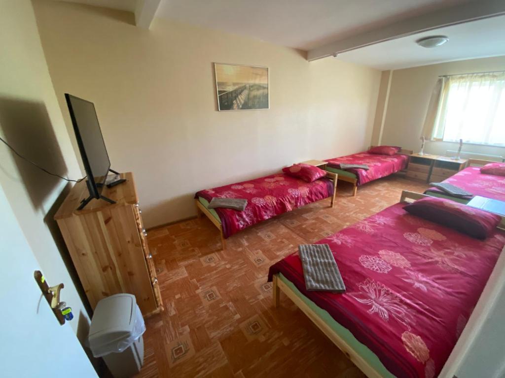 Ένα ή περισσότερα κρεβάτια σε δωμάτιο στο VILAR HOSTEL