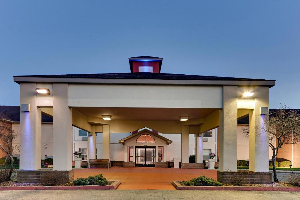 a large white building with a chimney on top at Holiday Inn Express & Suites Bad Axe, an IHG Hotel in Bad Axe