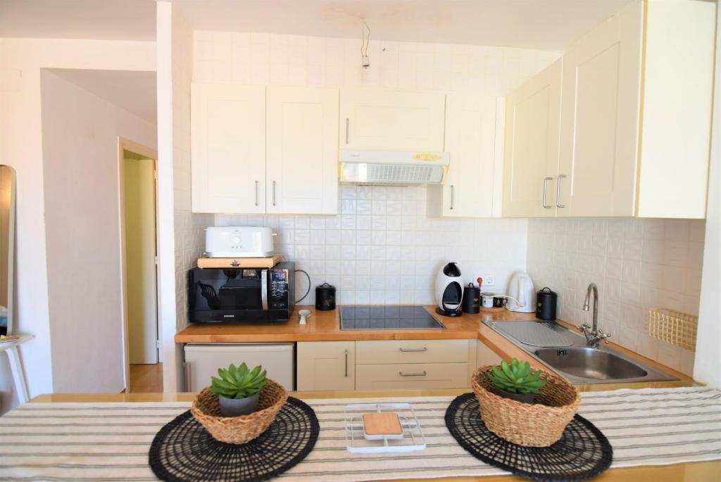 Kuchyň nebo kuchyňský kout v ubytování 394-Duplex moderno cerca playa y en pleno centro