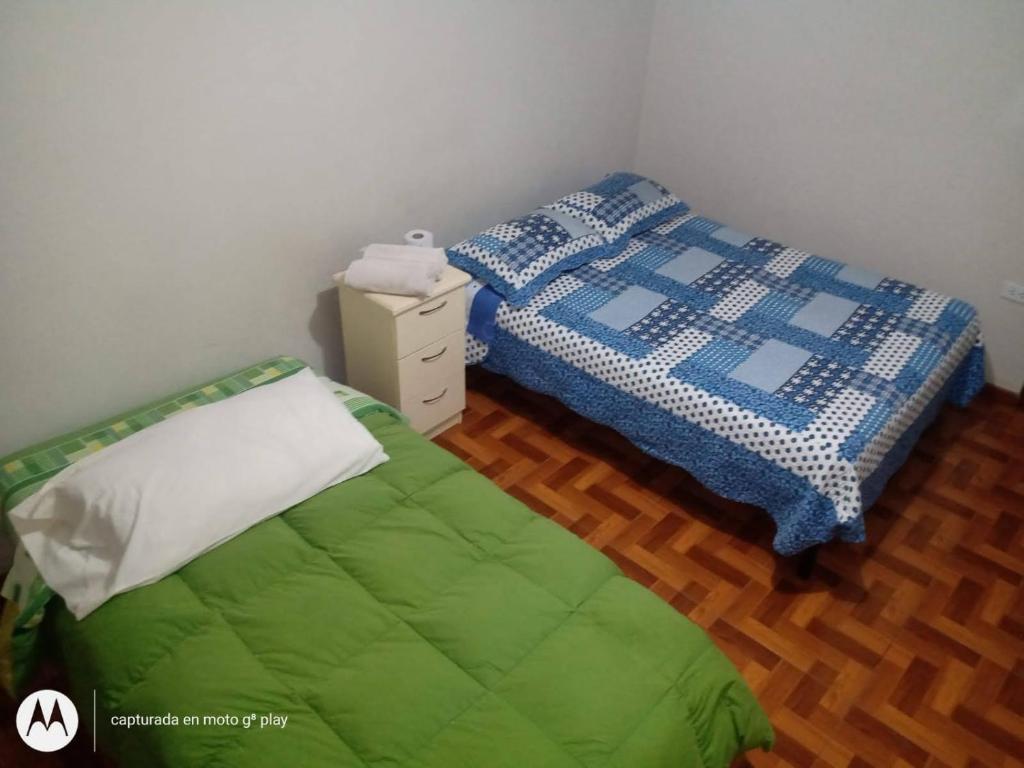 Postel nebo postele na pokoji v ubytování Hostal Kmr