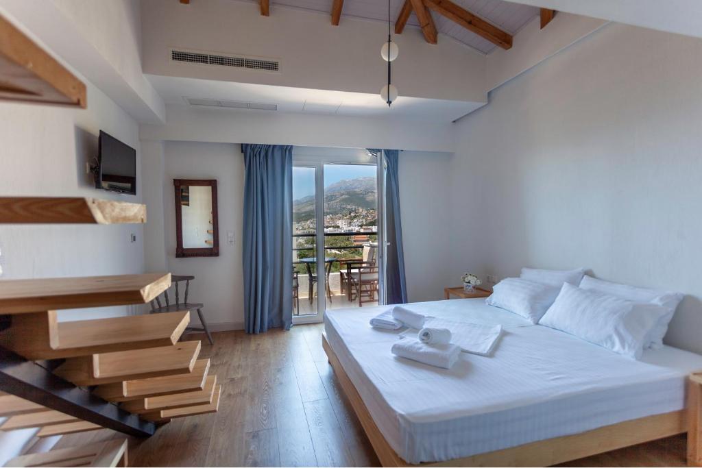 Postel nebo postele na pokoji v ubytování Toni Retzo Rooms