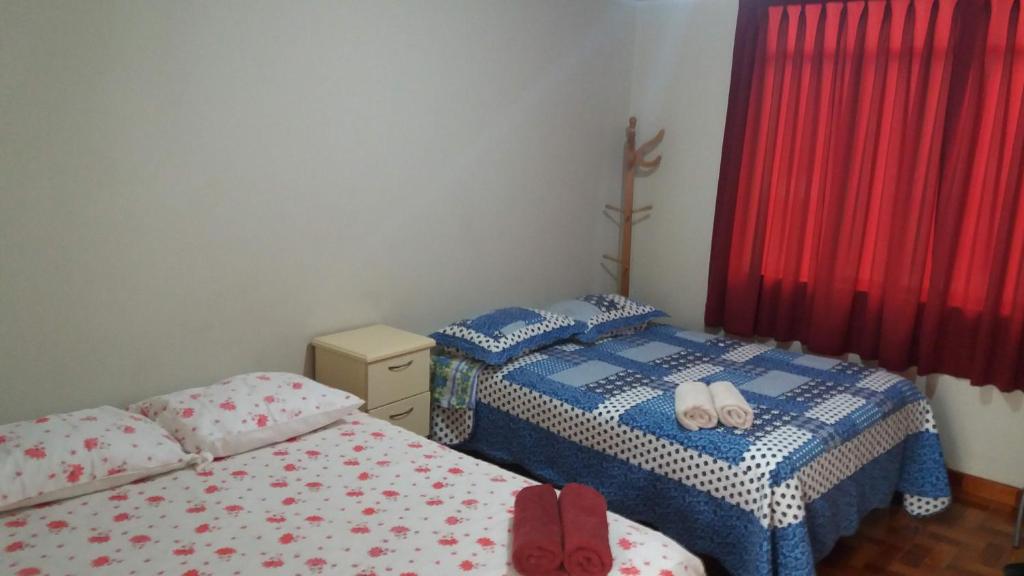 Postel nebo postele na pokoji v ubytování Hostal Kmr