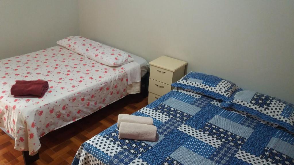 Postel nebo postele na pokoji v ubytování Hostal Kmr