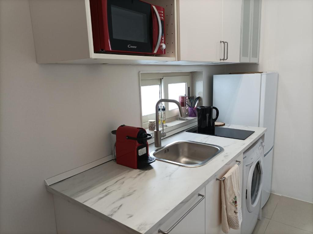 Kuchyň nebo kuchyňský kout v ubytování AmendolaRoom