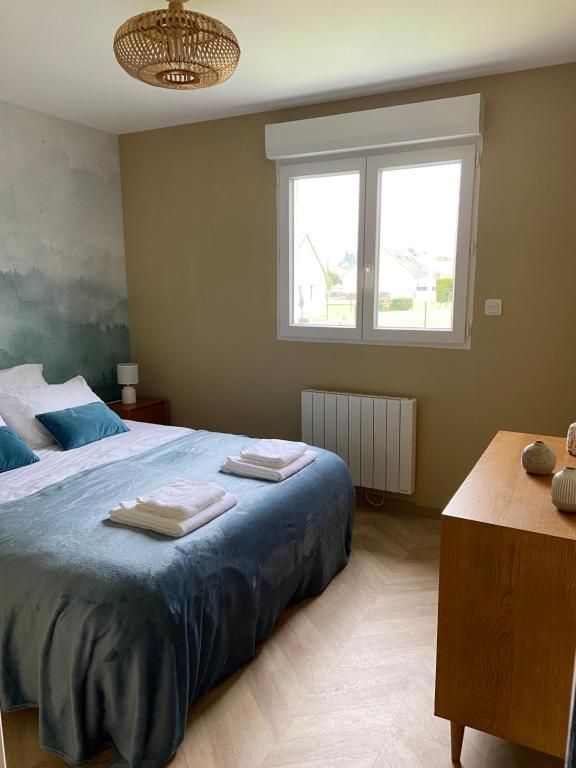 Postel nebo postele na pokoji v ubytování La Charmeraie : Le Logis