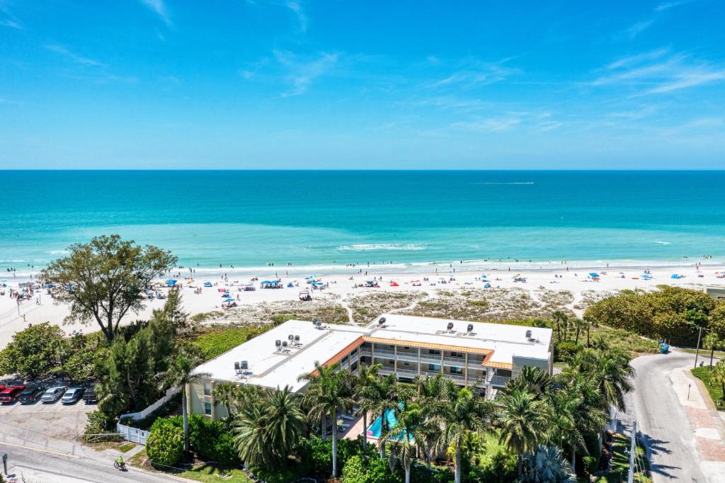 an aerial view of a beach and a hotel at AMI Dreaming - 4200 Gulf 105 in Holmes Beach