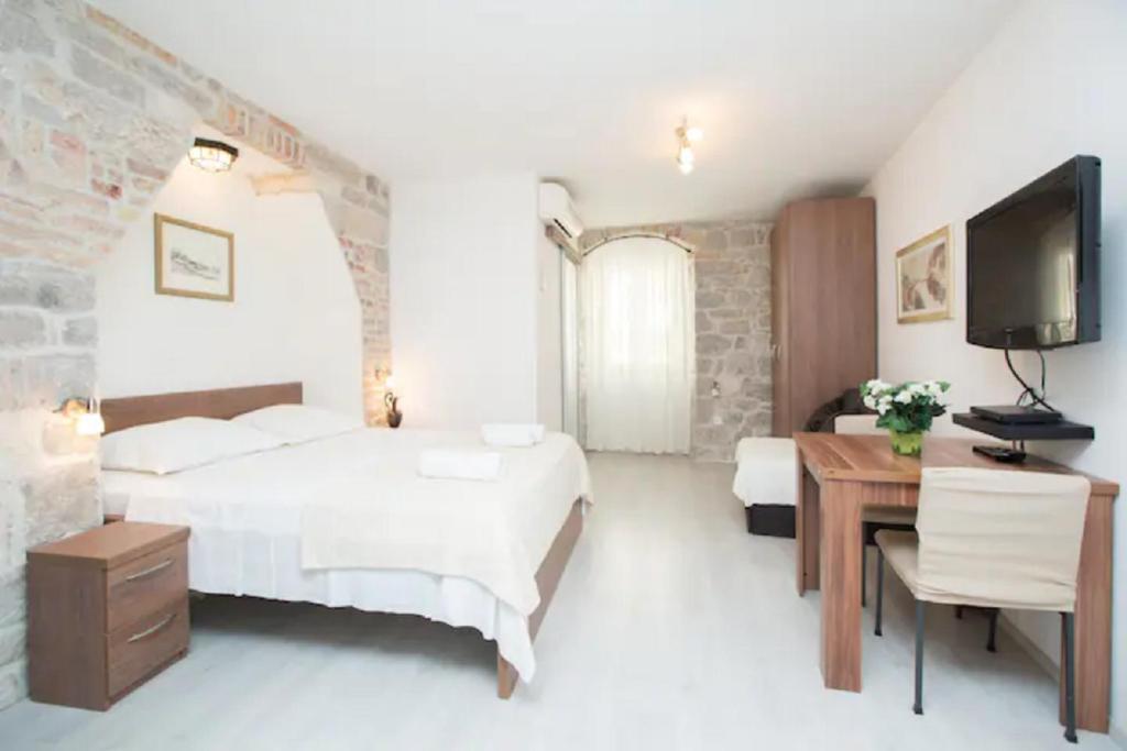 Posteľ alebo postele v izbe v ubytovaní Apartments Centrum Split