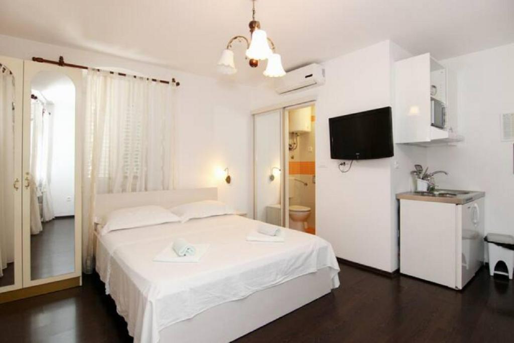 Posteľ alebo postele v izbe v ubytovaní Apartments Centrum Split