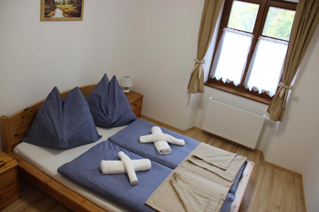 Postel nebo postele na pokoji v ubytování Groppenstein Apartmanház
