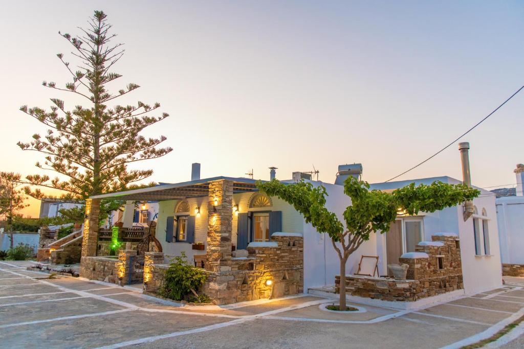 a house with lights on it in a parking lot at Θἔρως (Theros) house 3- Agios Fokas in Agios Sostis