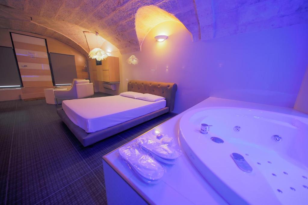 Postel nebo postele na pokoji v ubytování Cleros Sky Lounge