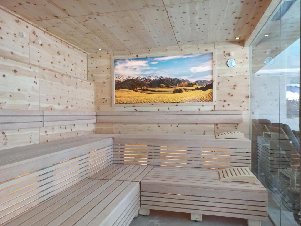 TV a/nebo společenská místnost v ubytování Hotel Alpenroyal