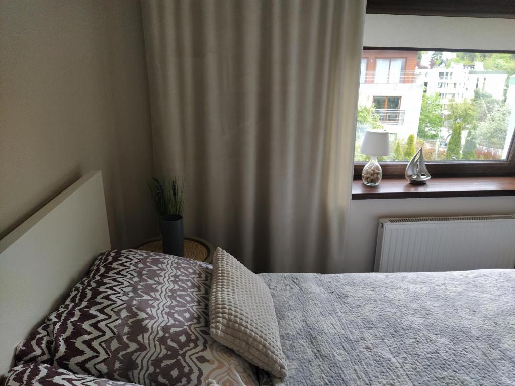 Posteľ alebo postele v izbe v ubytovaní Apartament z tarasem