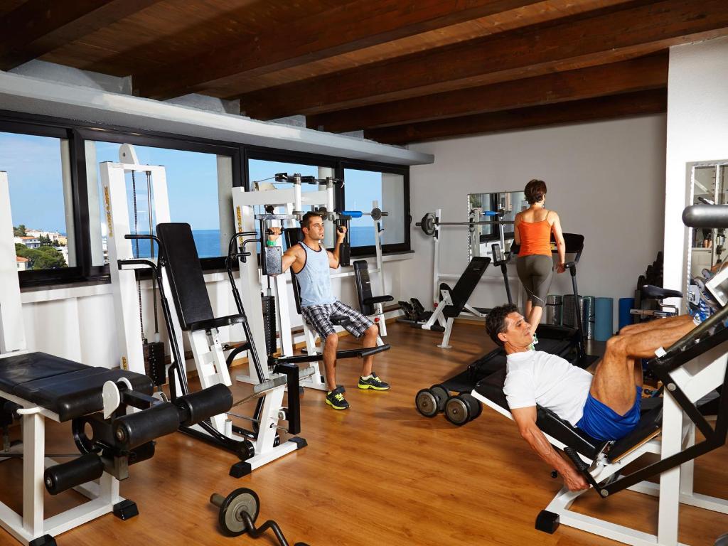 a group of people working out in a gym at Hotel Cala Luna in Cala Gonone