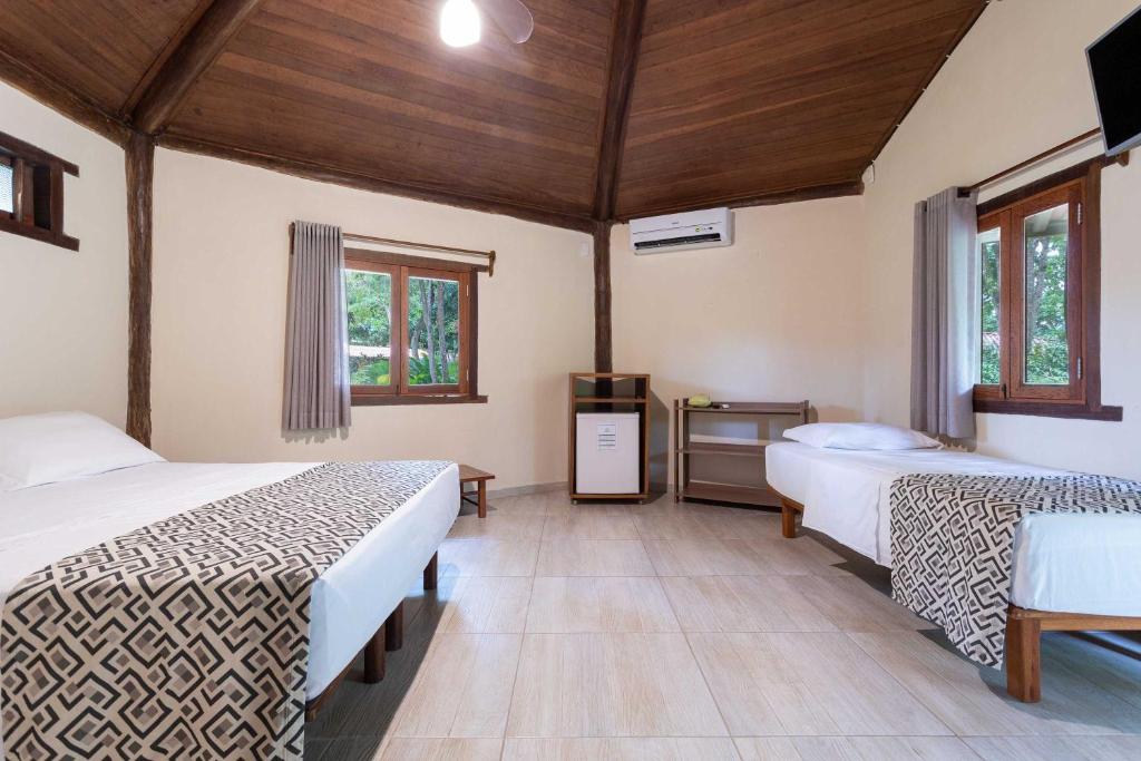 Postel nebo postele na pokoji v ubytování Canto d Alvorada Hotel Pousada