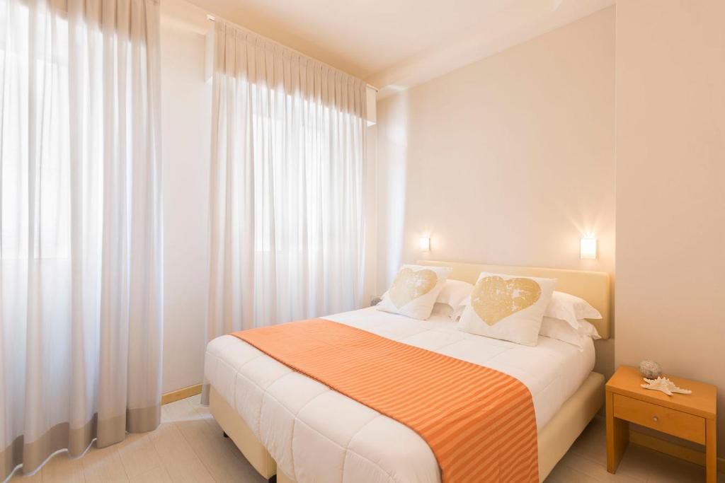 Postel nebo postele na pokoji v ubytování Hotel Commodore