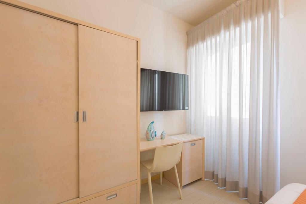TV a/nebo společenská místnost v ubytování Hotel Commodore