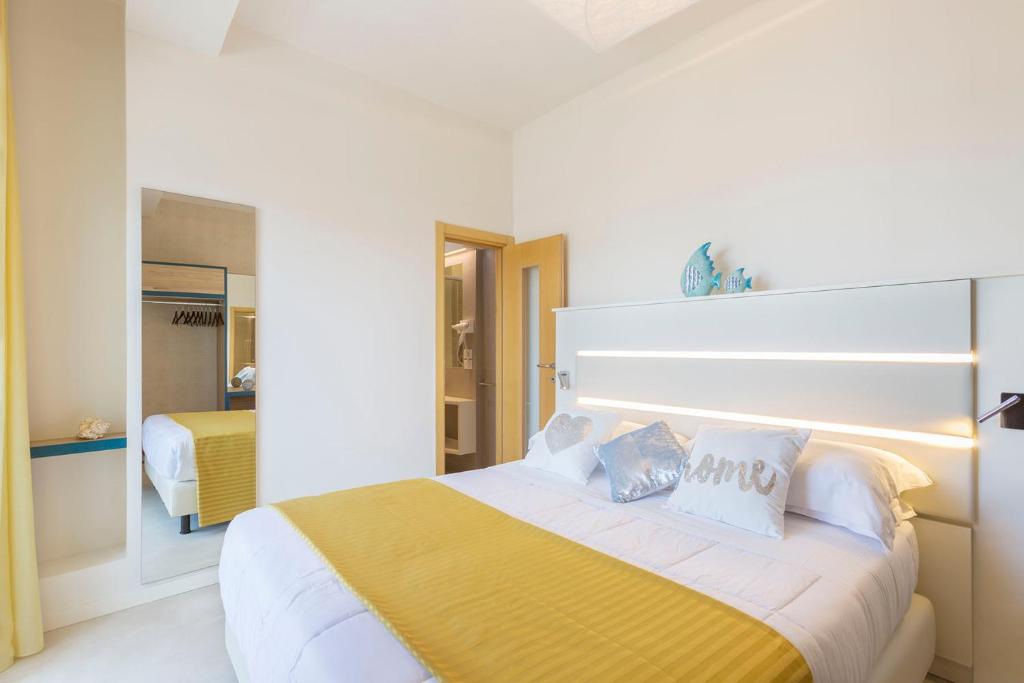 Postel nebo postele na pokoji v ubytování Hotel Commodore