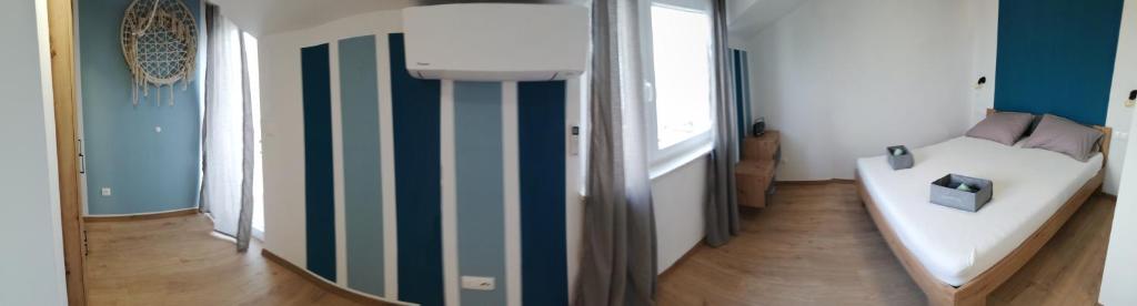 Posteľ alebo postele v izbe v ubytovaní NiMaRo apartman, Okrug Gornji