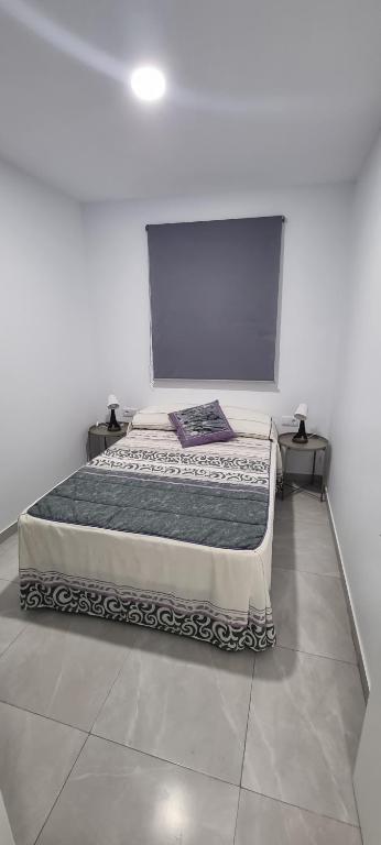 Postel nebo postele na pokoji v ubytování Apartamentos La Playa