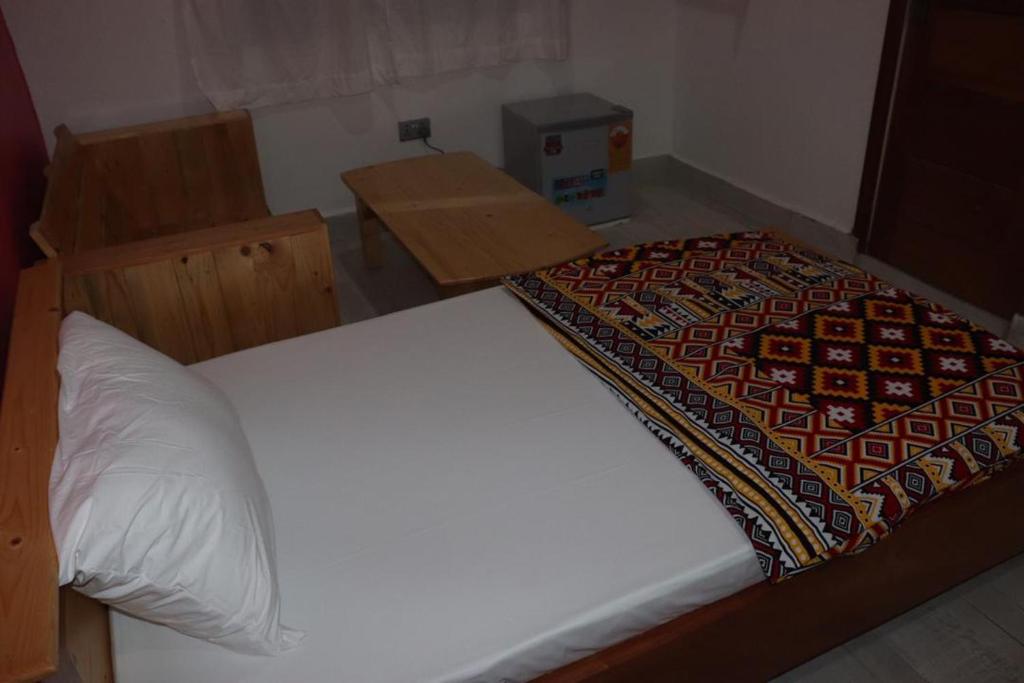 Ein Bett oder Betten in einem Zimmer der Unterkunft Theo Goodlife Hotel
