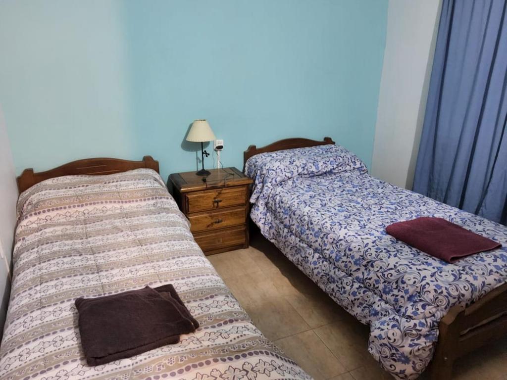 Giường trong phòng chung tại Munzenmayer Servicios