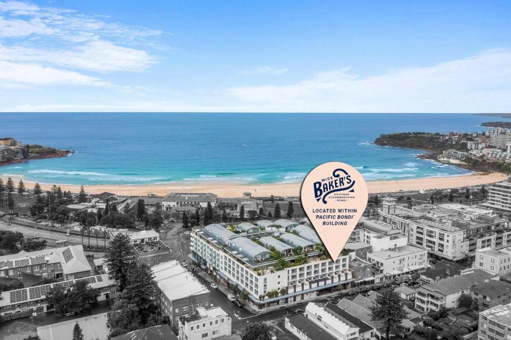 an overhead view of a city with a beach at Miss Baker's Boutique Accommodation Bondi in Sydney