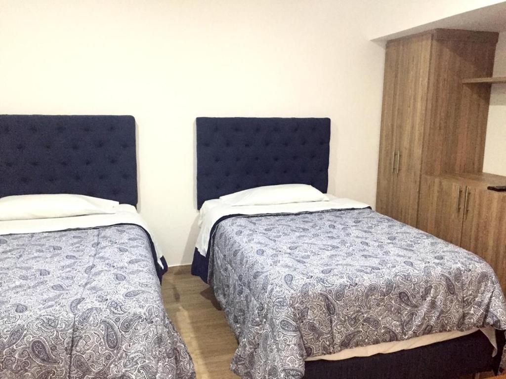Łóżko lub łóżka w pokoju w obiekcie CASA JURADO