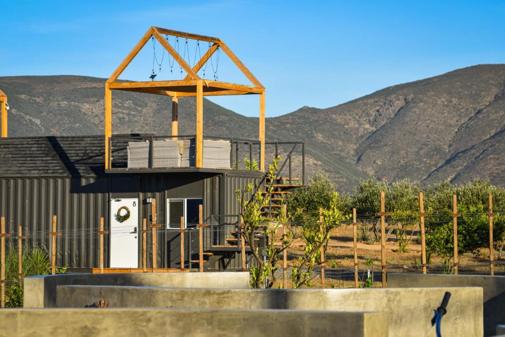 a building with a clock on top of it at Lumi in Valle de Guadalupe