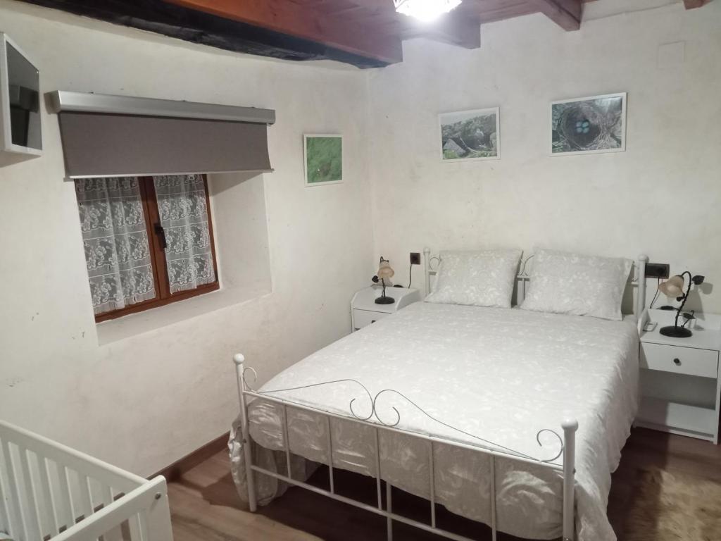 En eller flere senge i et værelse på "Apartamento Peña Sagra"