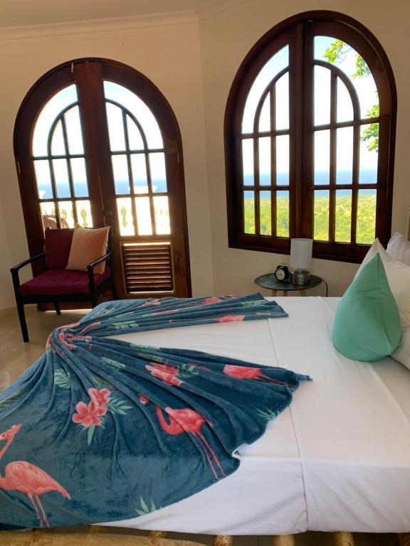 Postel nebo postele na pokoji v ubytování El Castillo Tropical