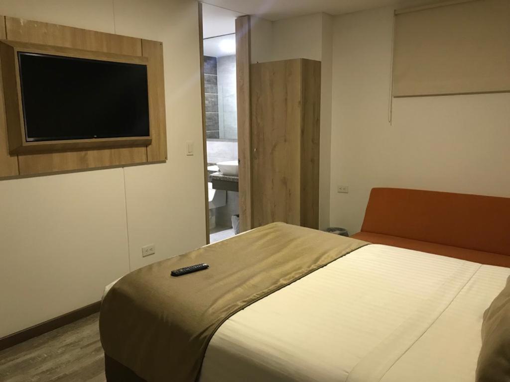 Postel nebo postele na pokoji v ubytování HM HOTEL Expo Inn