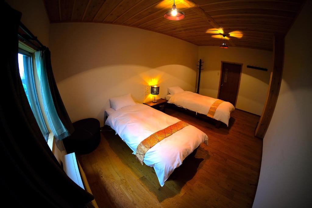 Postel nebo postele na pokoji v ubytování HA-MON Slope Side Hotel and Private Chalet
