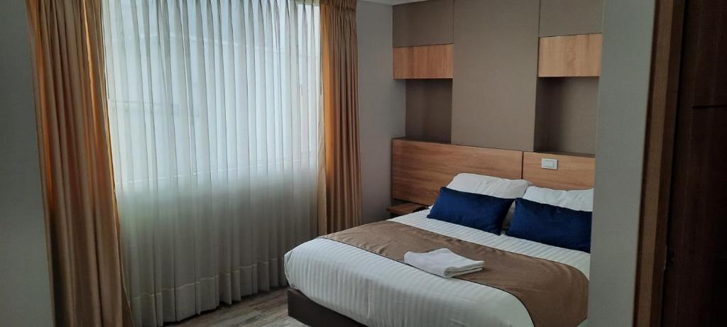 Postel nebo postele na pokoji v ubytování HM HOTEL Expo Inn