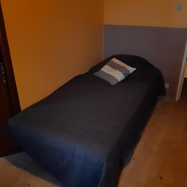 Postel nebo postele na pokoji v ubytování ferme de Bournazel