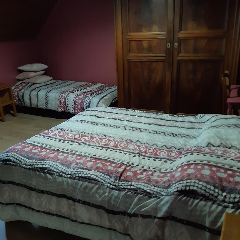 Postel nebo postele na pokoji v ubytování ferme de Bournazel