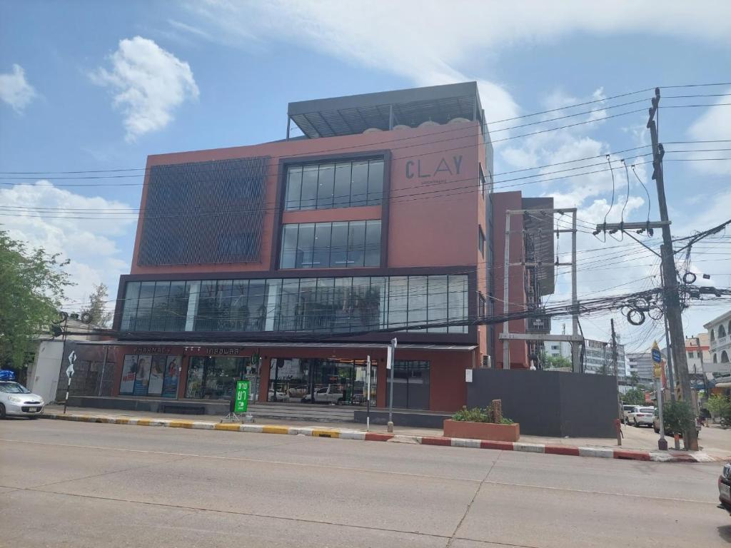 a large building on the corner of a street at Clay Hotel Udonthani in Udon Thani