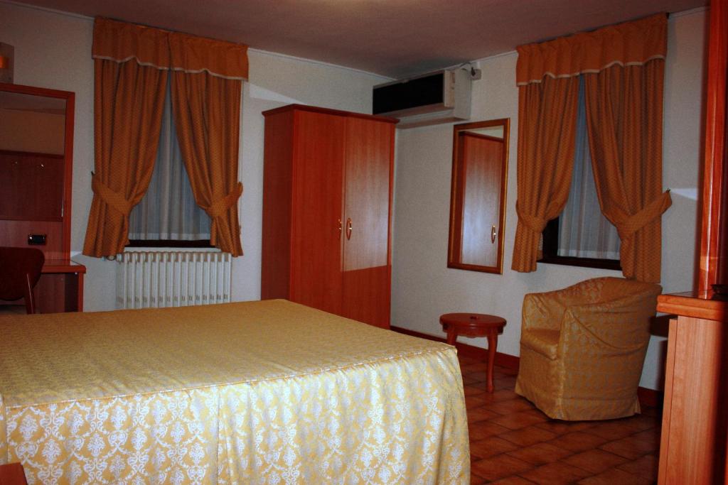 Postel nebo postele na pokoji v ubytování Piccolo Hotel