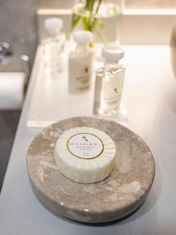 a plate with a bottle of soap on a counter at Sa'Rezya Hotel in Çeşme